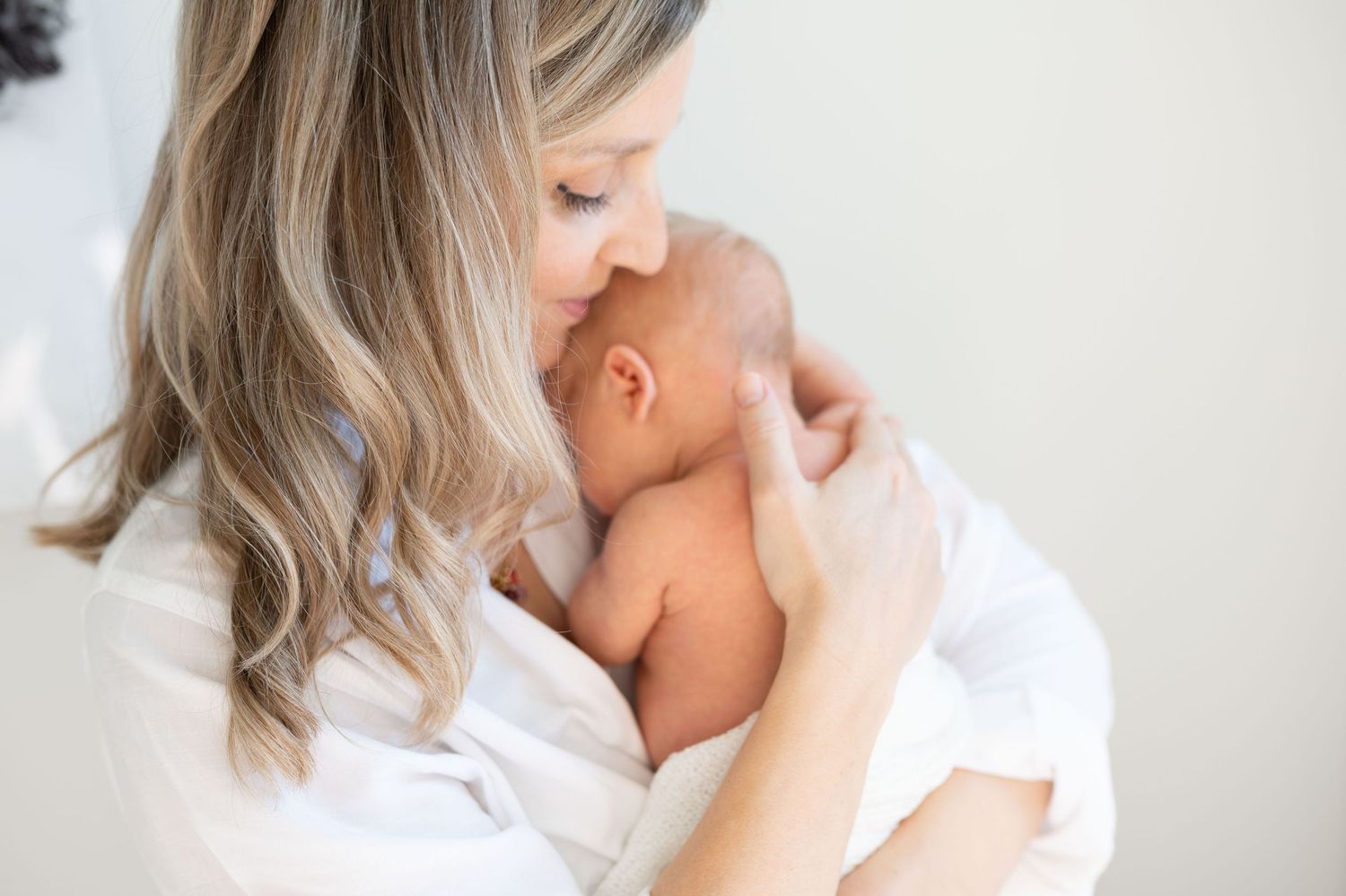 Tender mother and newborn portrait natural light Nashville portrait studio Thompson’s Station