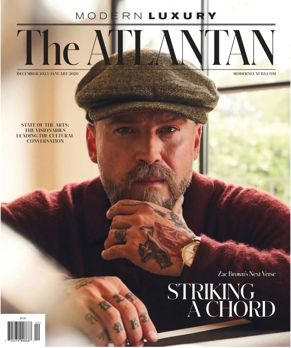 Magazine covers of The Atlantan showing a person in a flat cap enjoying a cigar in dramatic lighting.