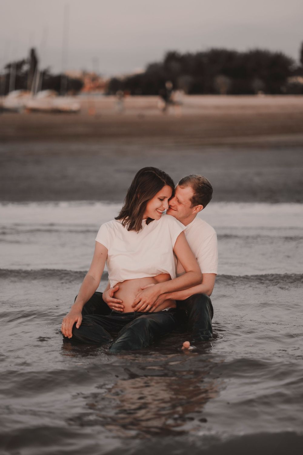 Final timeless shot of an engaged couple watching the horizon near Madonna dell'Angelo shrine.