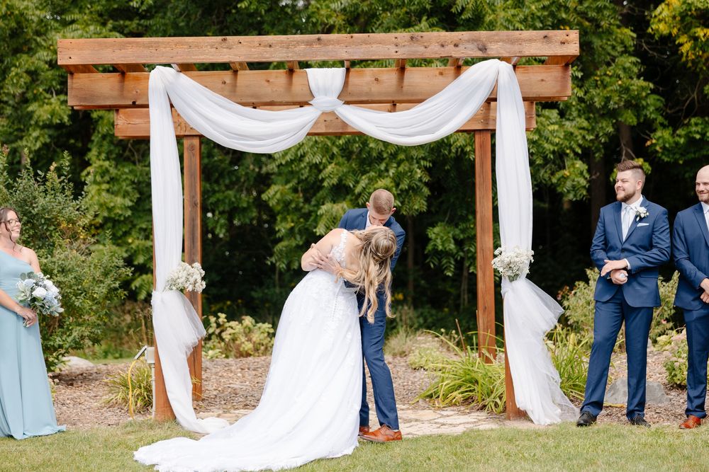 A romantic sequence of wedding photos showing couples posing under a wooden arch decorated with white fabric in an outdoor setting.