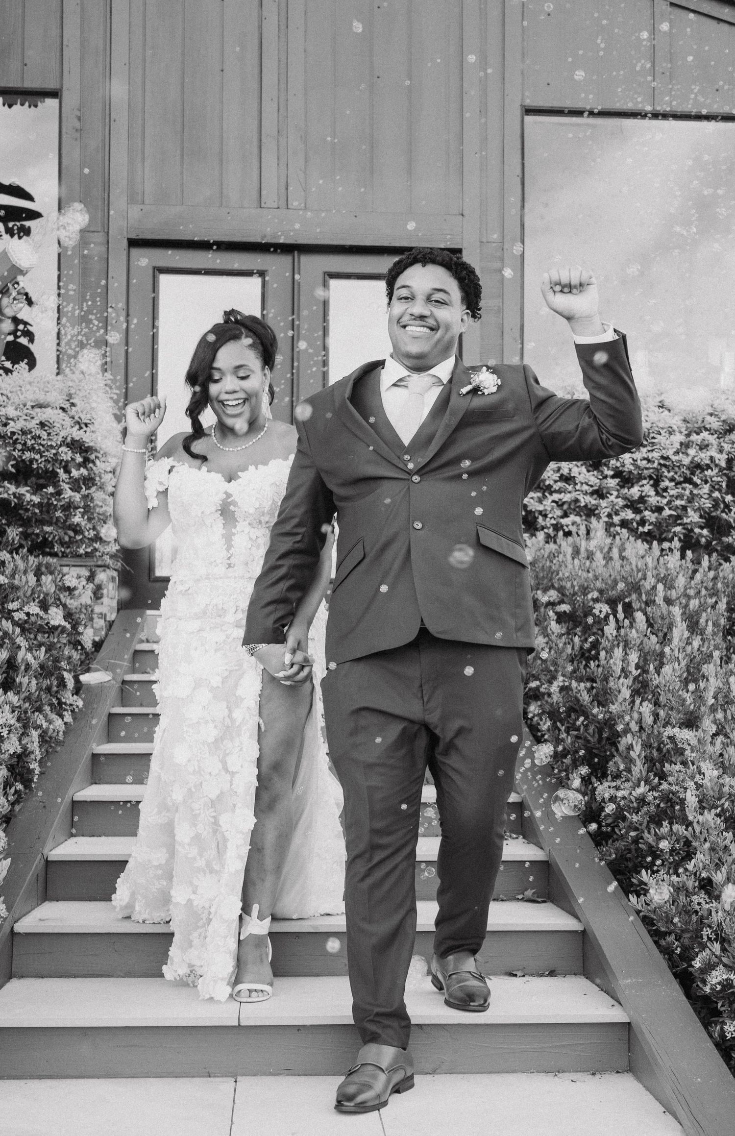 Black and white photos capture newlyweds in playful poses on outdoor steps.