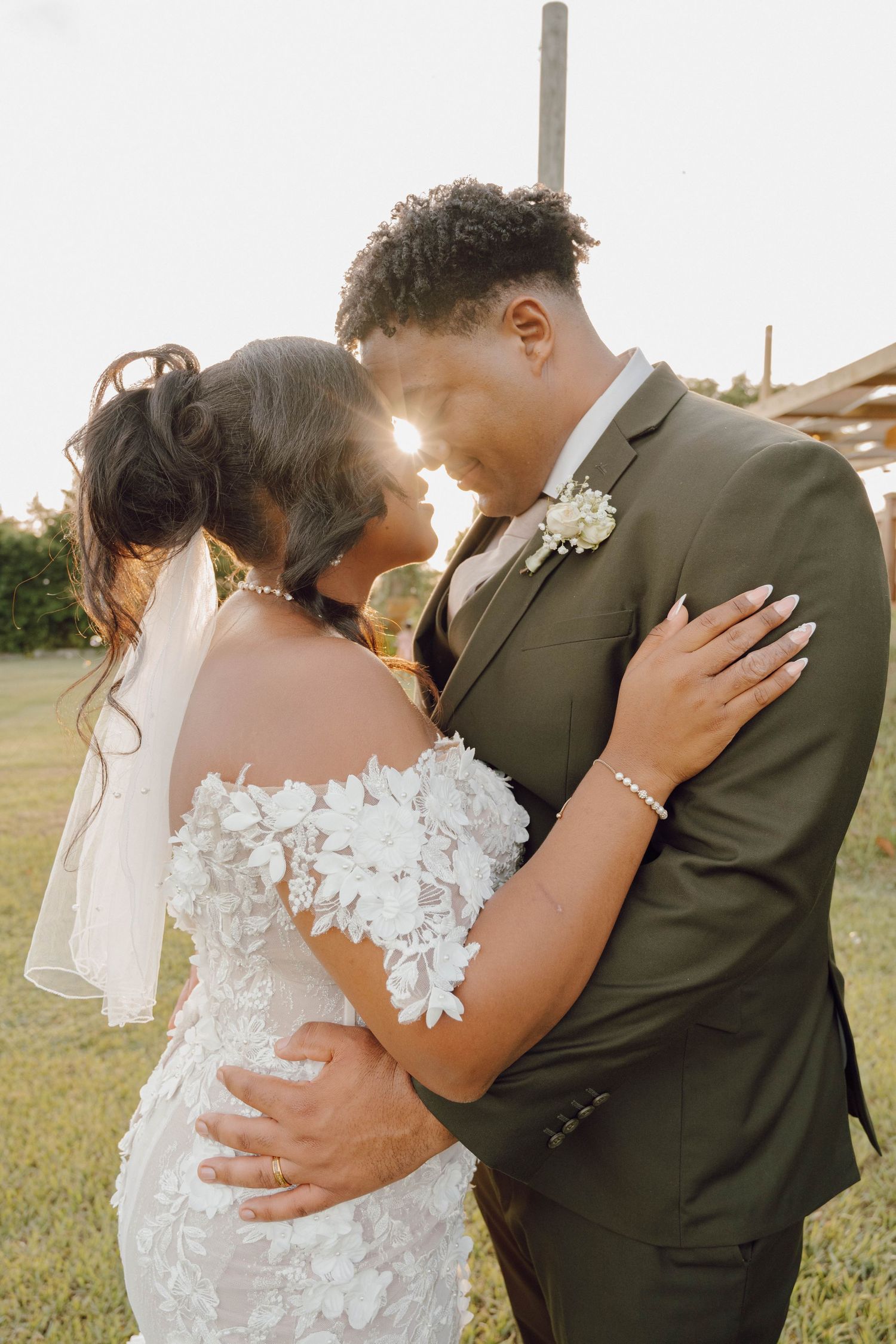 Romantic sunset wedding portraits showing intimate moments between newlyweds in an outdoor setting.
