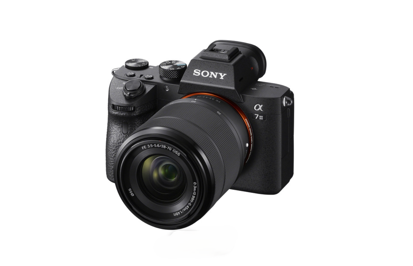 Sony Alpha a7 III mirrorless digital camera with 28-70mm lens on white background.