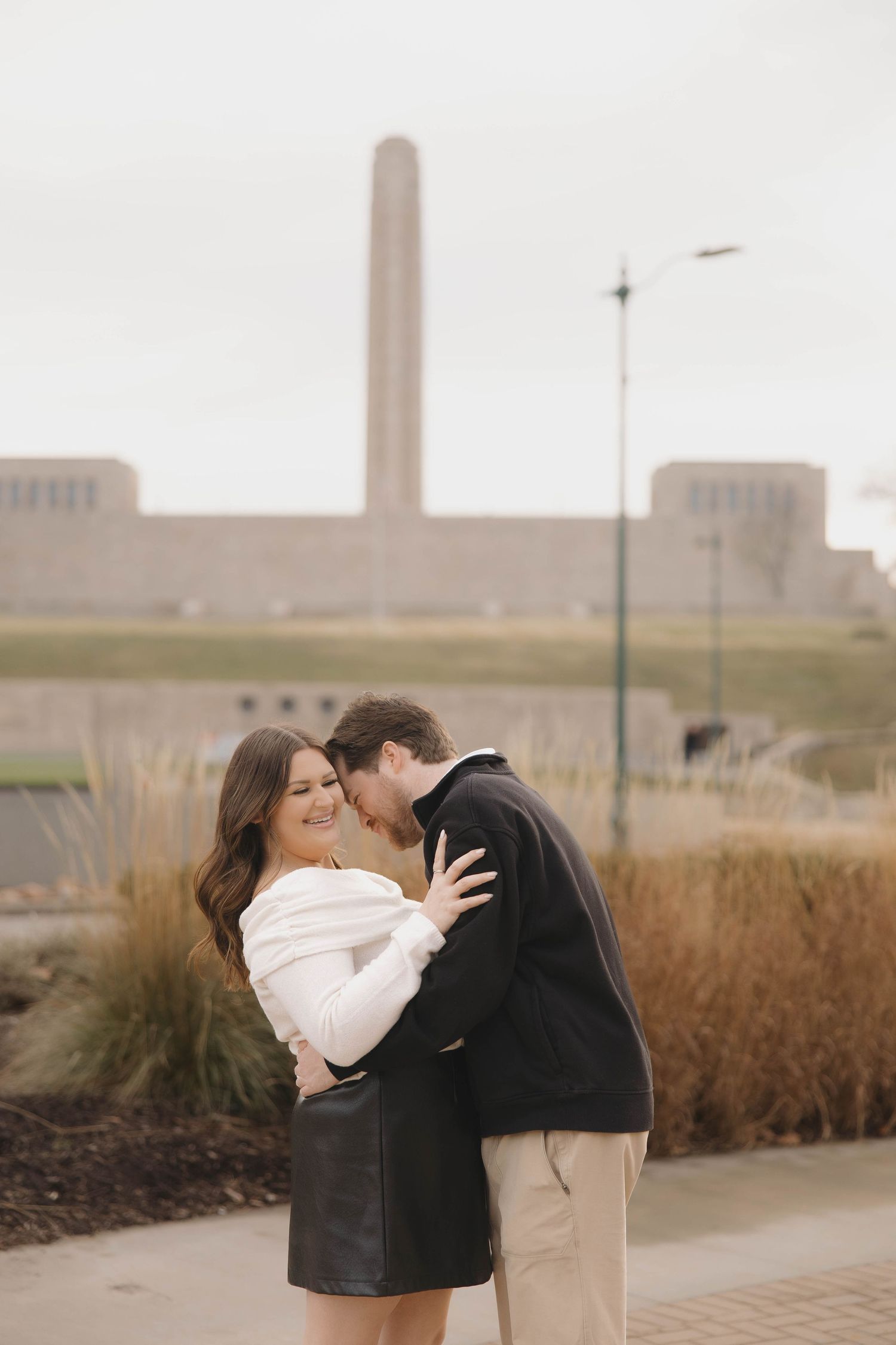 A romantic sequence of photos with an industrial skyline and tall buildings in the background.