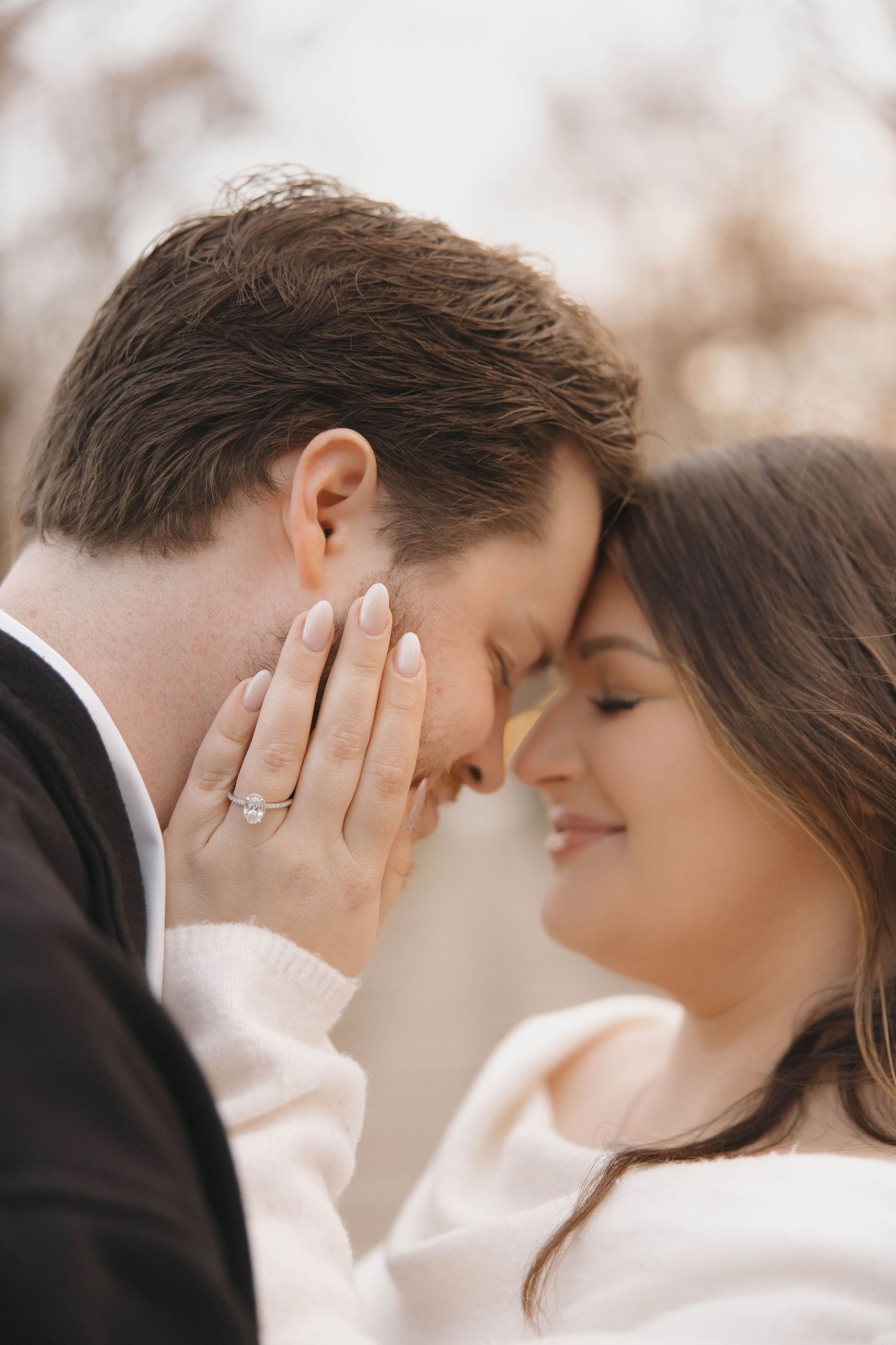 Close-up romantic moment captured in soft lighting with a dreamy atmosphere.