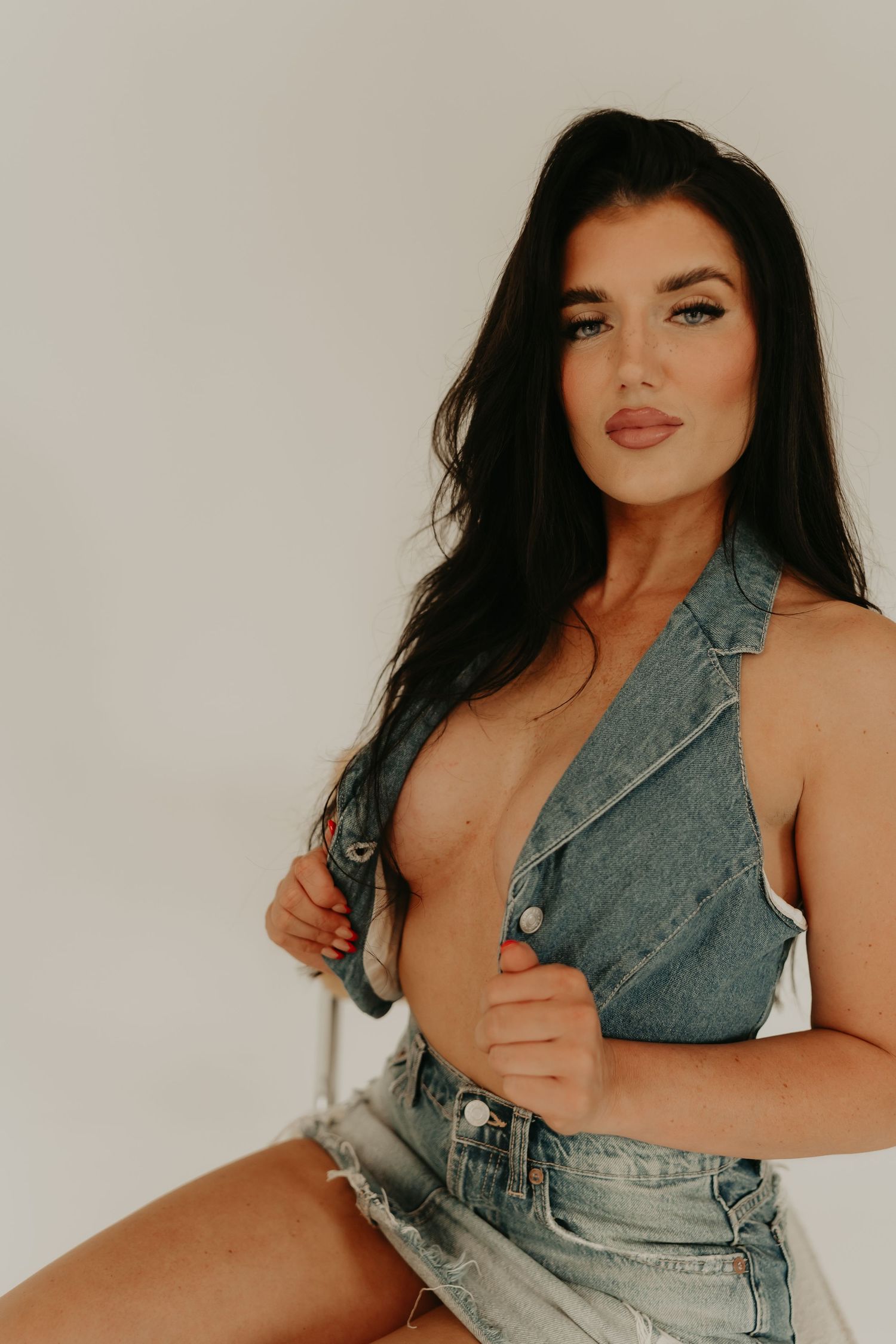 Boudoir photography session highlighting a woman's grace and self-love in a luxurious setting.