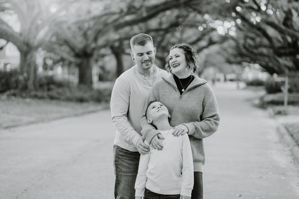 Black and white candid family photos showing playful moments in an outdoor setting.