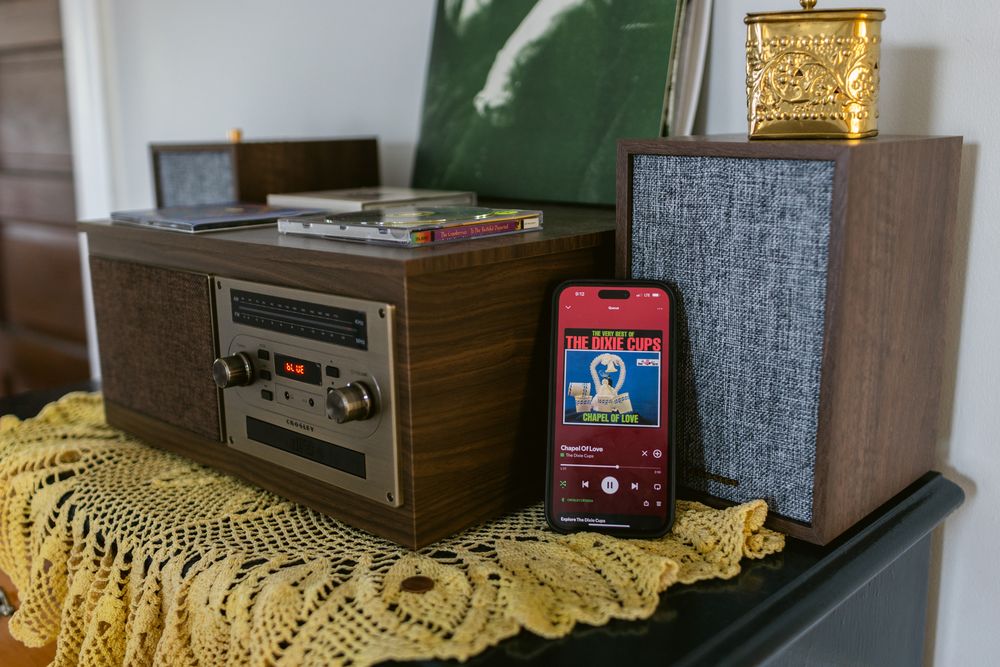 Detail shot of vintage record player at a home on a wedding day with the Walters song playing on an iPhone. Seacoast NH wedding photographer