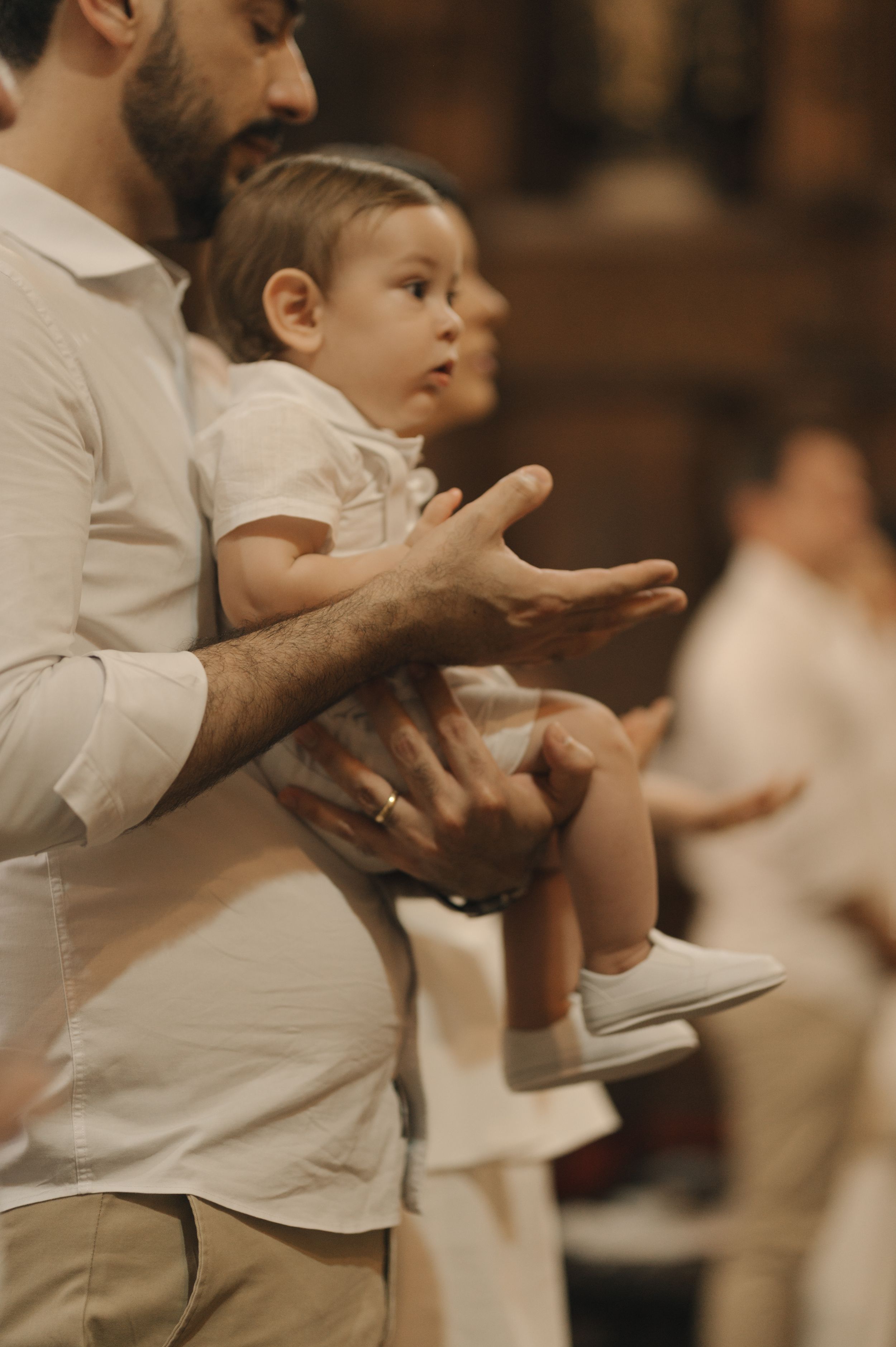 A child in a white shirt reaches forward with their hand in a sequence of progressive motion shots.