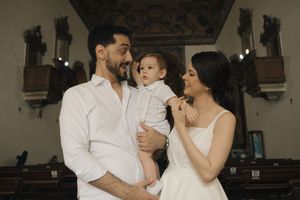A couple in white outfits share romantic moments in a series of connected photos.