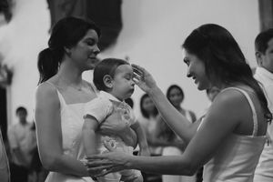 A series of black and white photos showing couples dancing together in an intimate ballroom setting.
