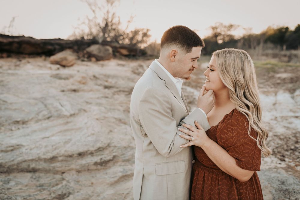 Engagement photos in open field Murrell Park Texas sunset.