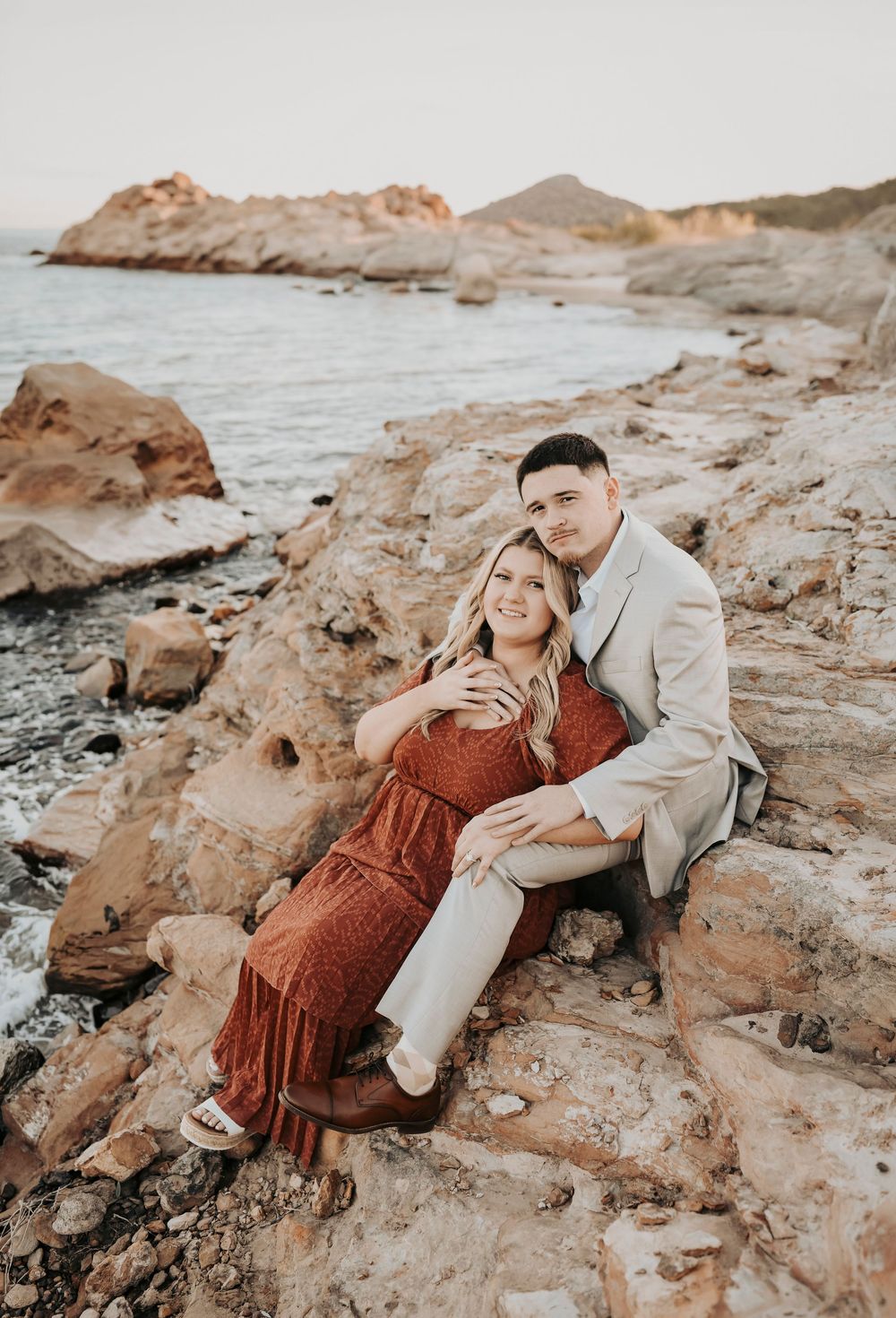 Engagement photos in Texas field with sunset and tall grass.