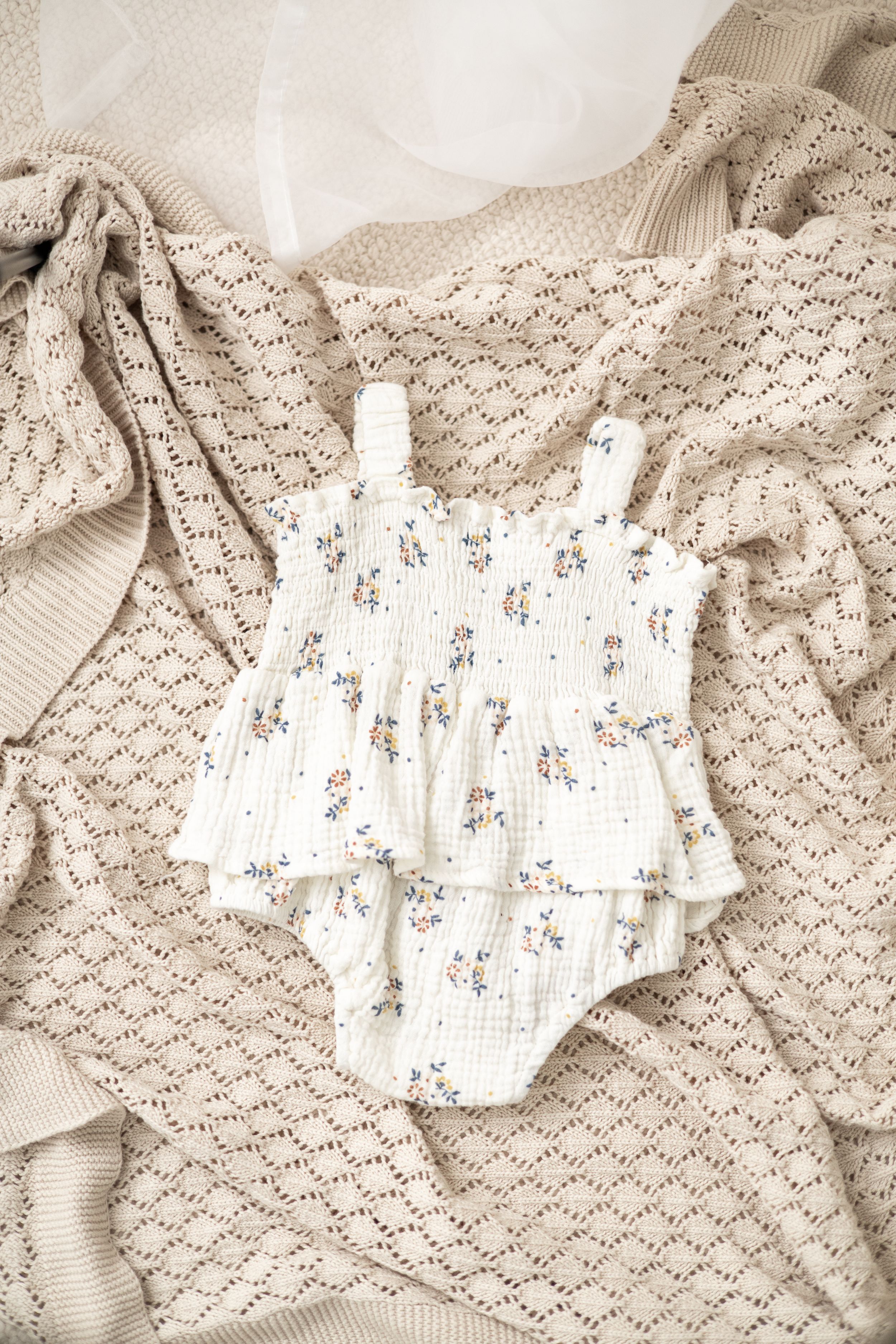 baby birthday outfit Nottingham soft tones and minimal floral print first birthday session