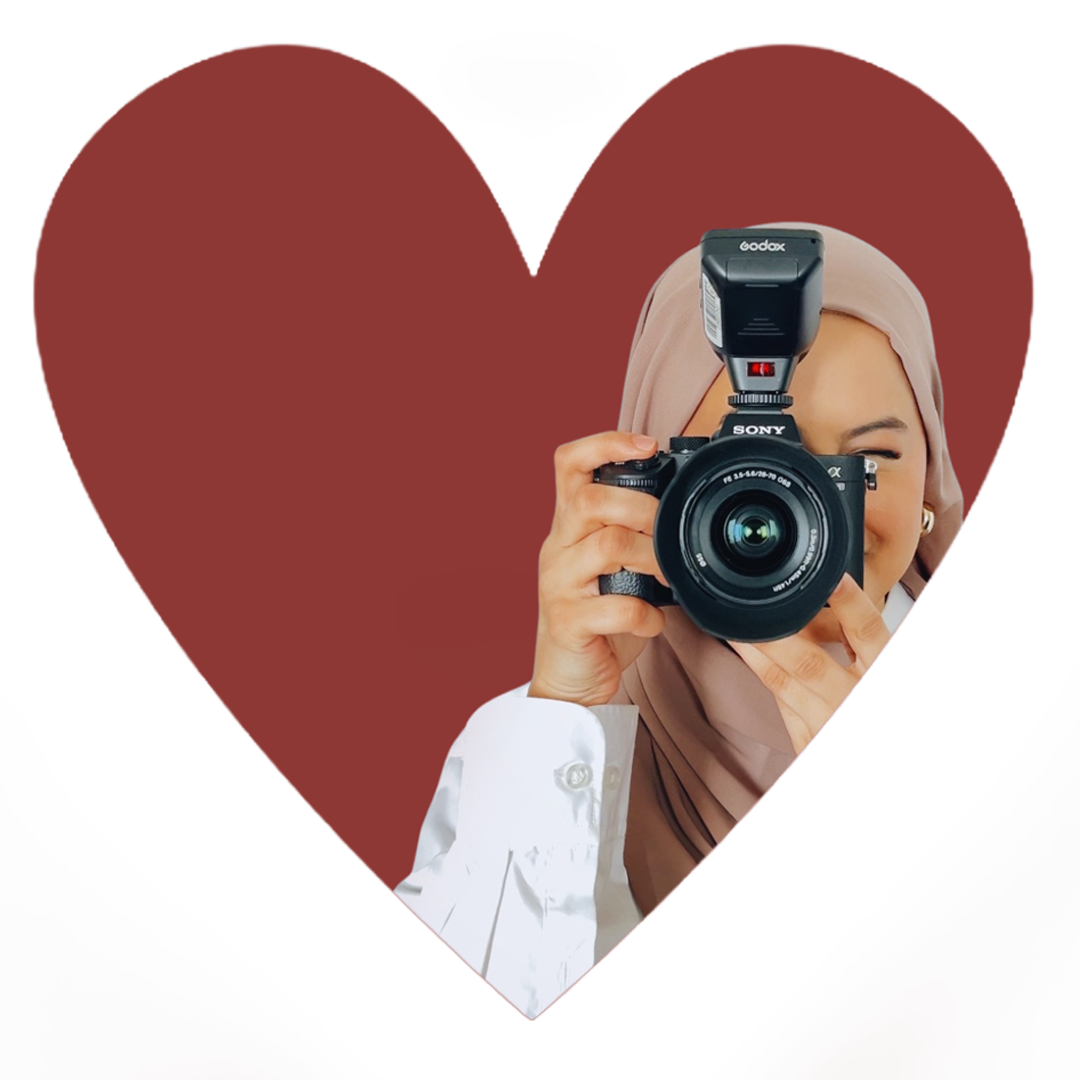 Sahar Rana, the photographer, holds a camera in hold. The headshot with red background is placed in a heart-shaped graphic.