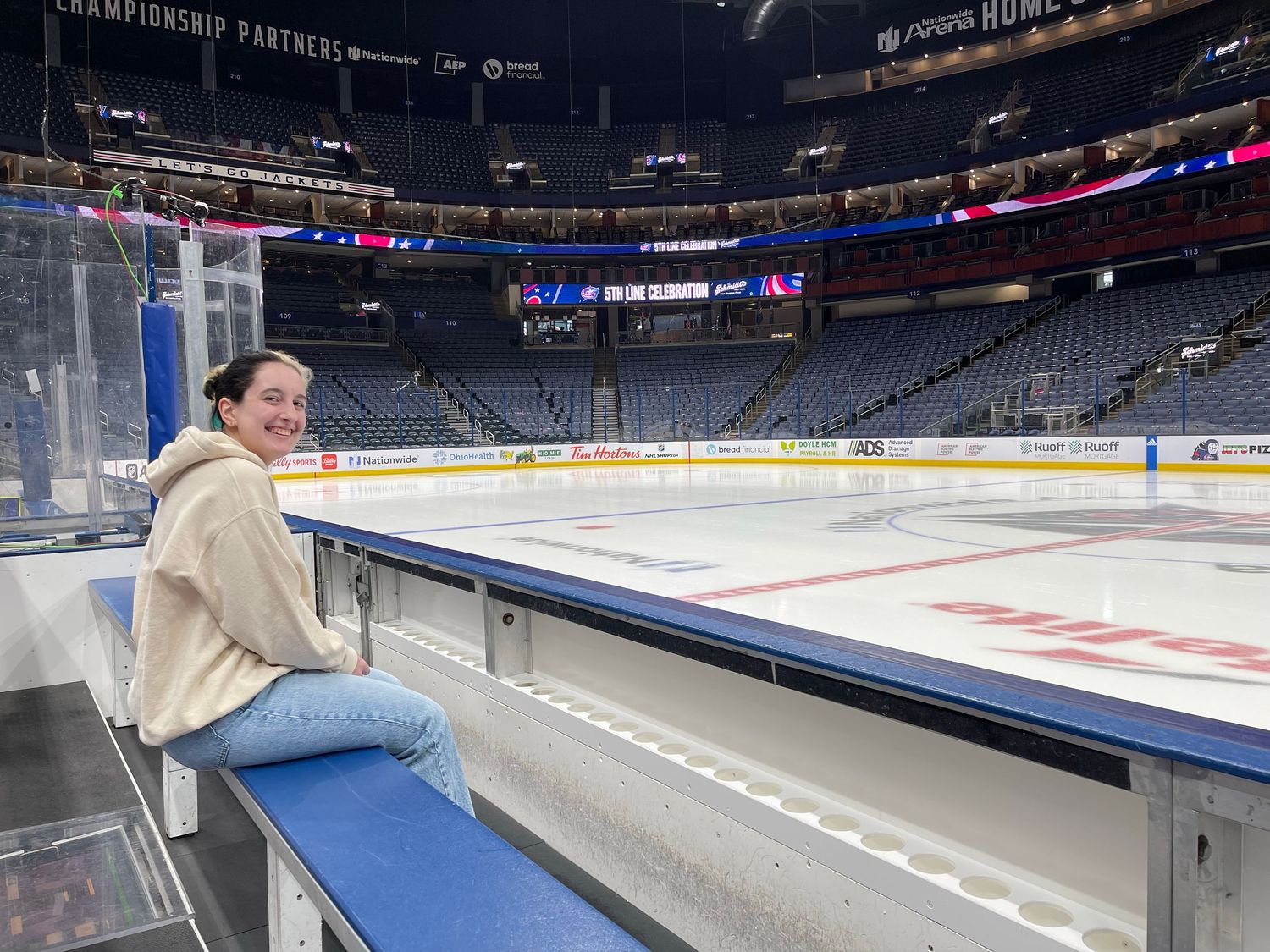A series of empty hockey arena seats and walkways shown from different angles inside a sports venue.