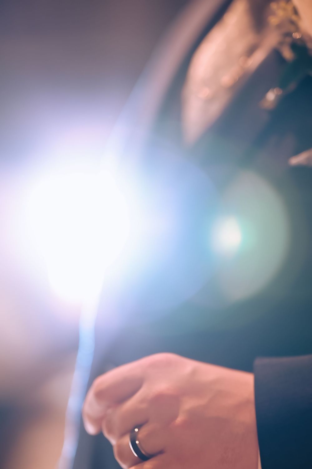 backlit detail shot of groom's tuxedo and wedding ring, Newfoundland wedding photography