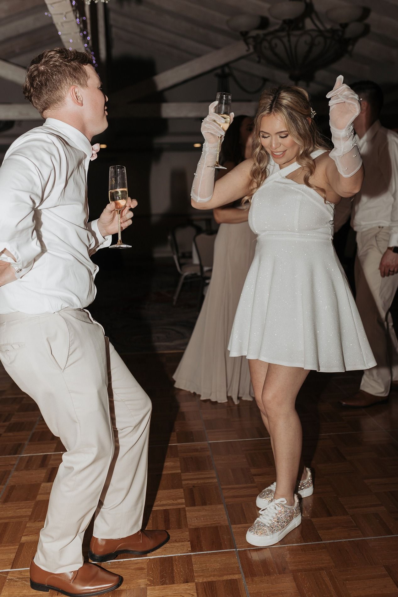 A bride and groom on the dance floor in a ballroom at Singing Hills Golf Resort.