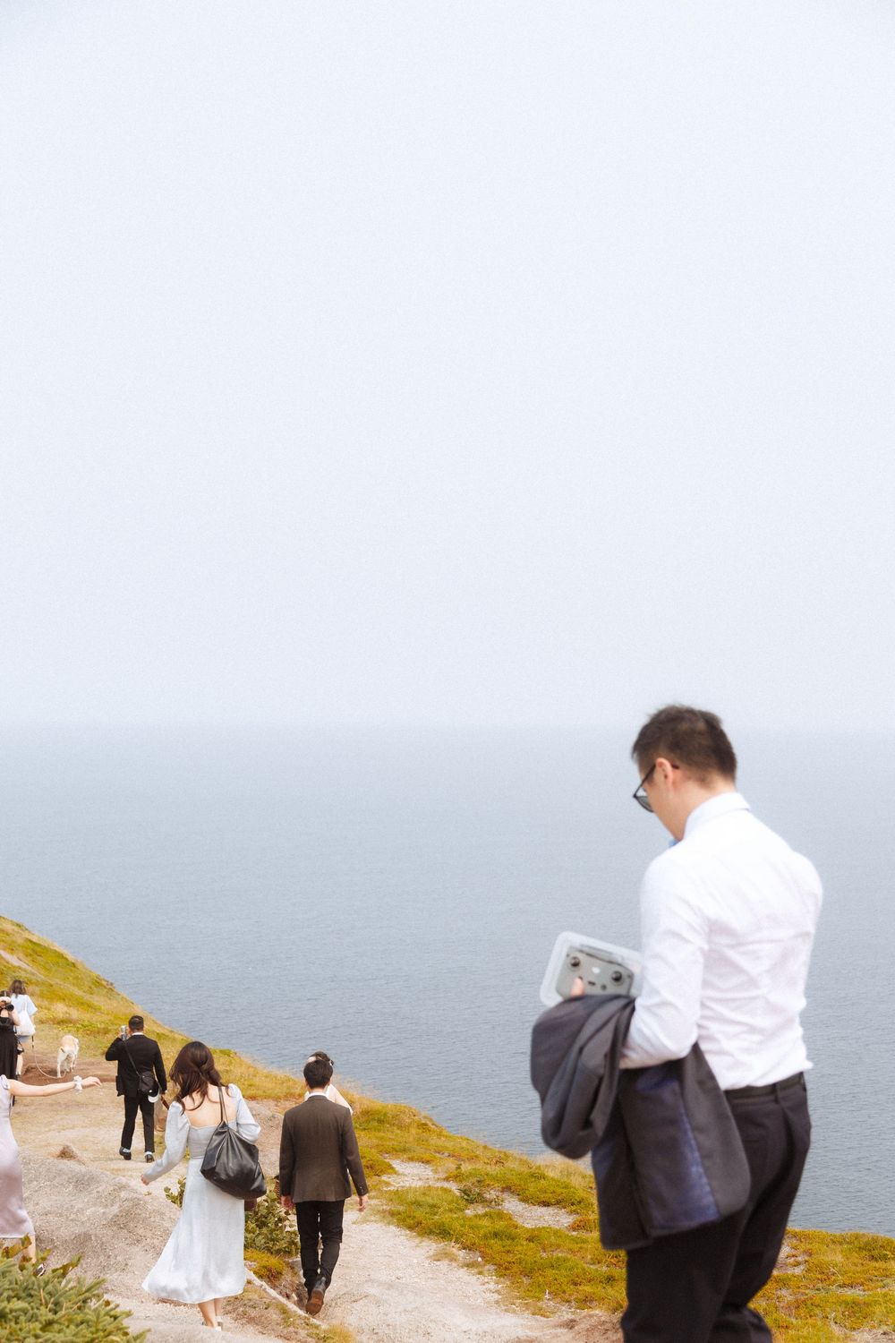 Wedding Ceremony at Torbay Point on the East Coast Trail captured by Newfoundland documentary style wedding photographer Kaitlyn yvette