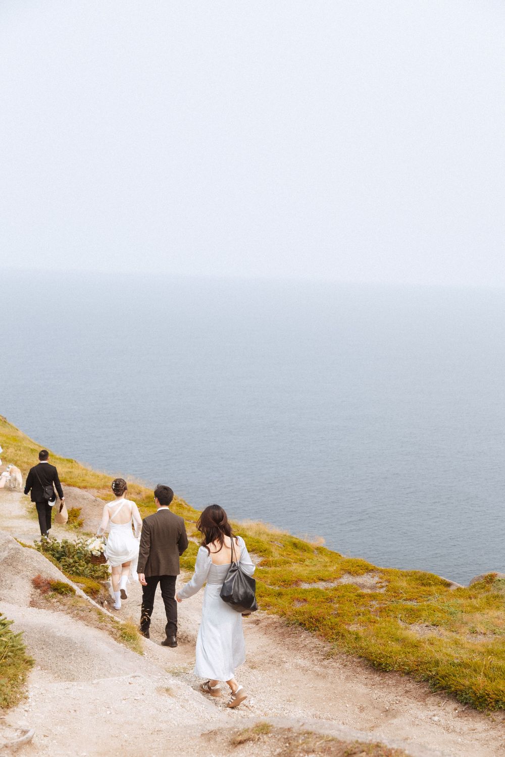 Wedding Ceremony at Torbay Point on the East Coast Trail captured by Newfoundland documentary style wedding photographer Kaitlyn yvette