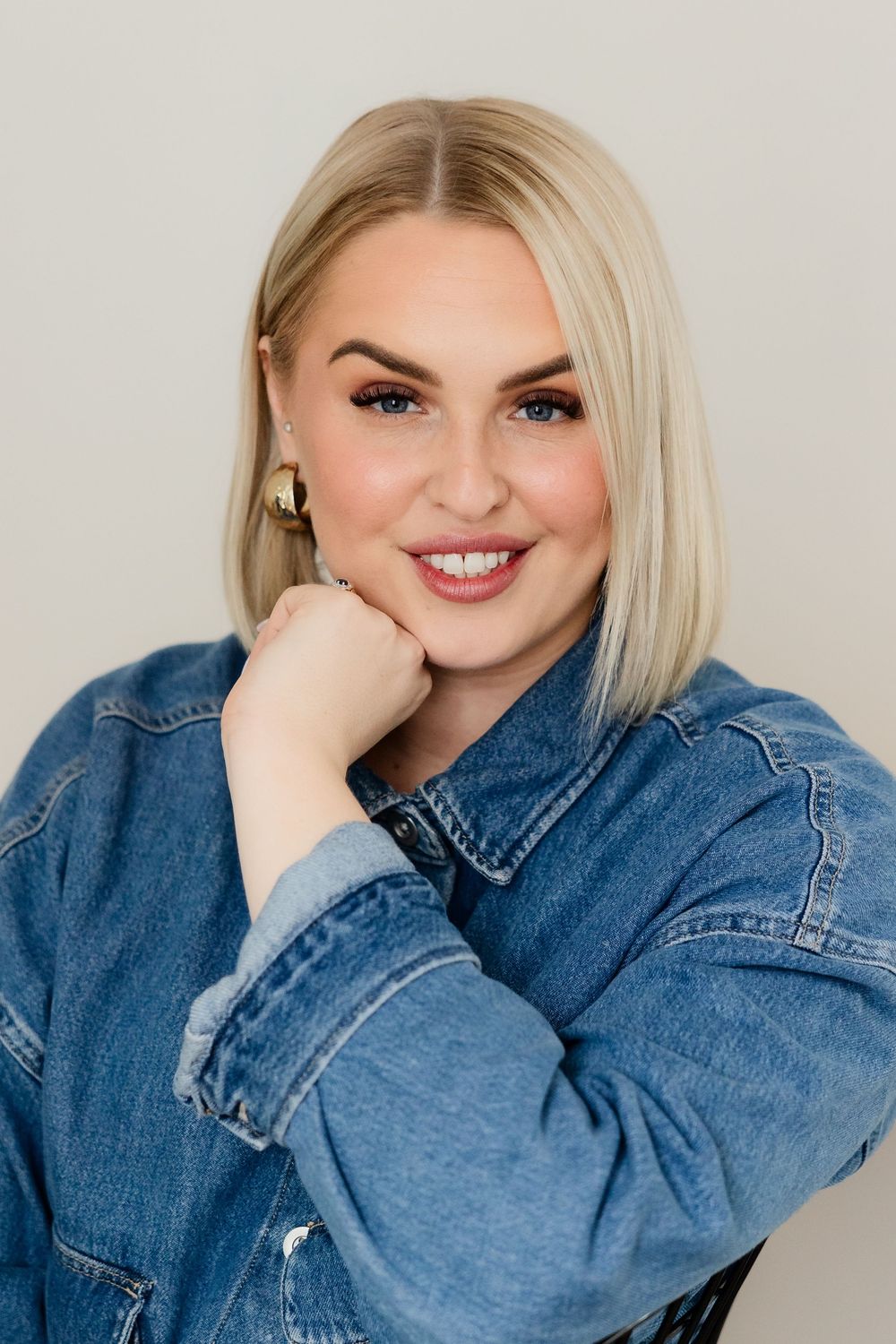 A series of playful portraits showing someone wearing a denim jacket against a light background.