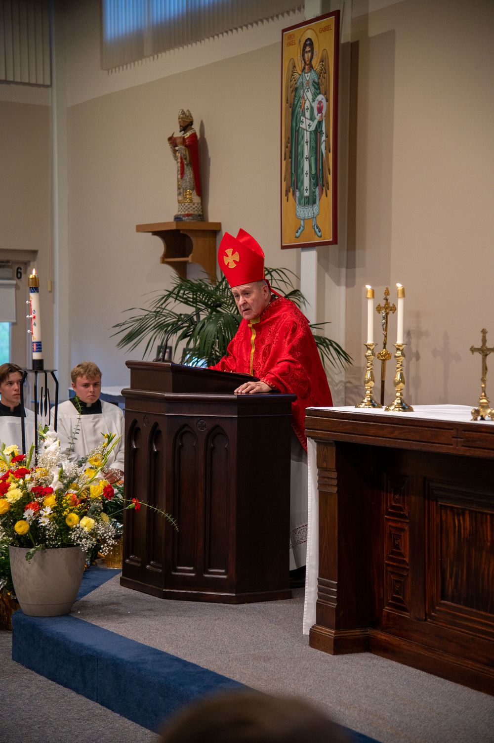 A Bishop of the Catholic Archdiocese of Saint Louis presides over a Confirmation Mass which was captured on film by an even photographer