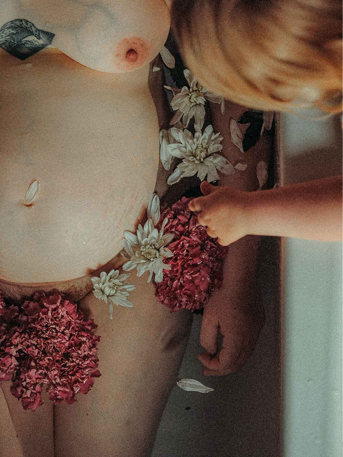 Art maternity photos with flowers in the bath in Heaton