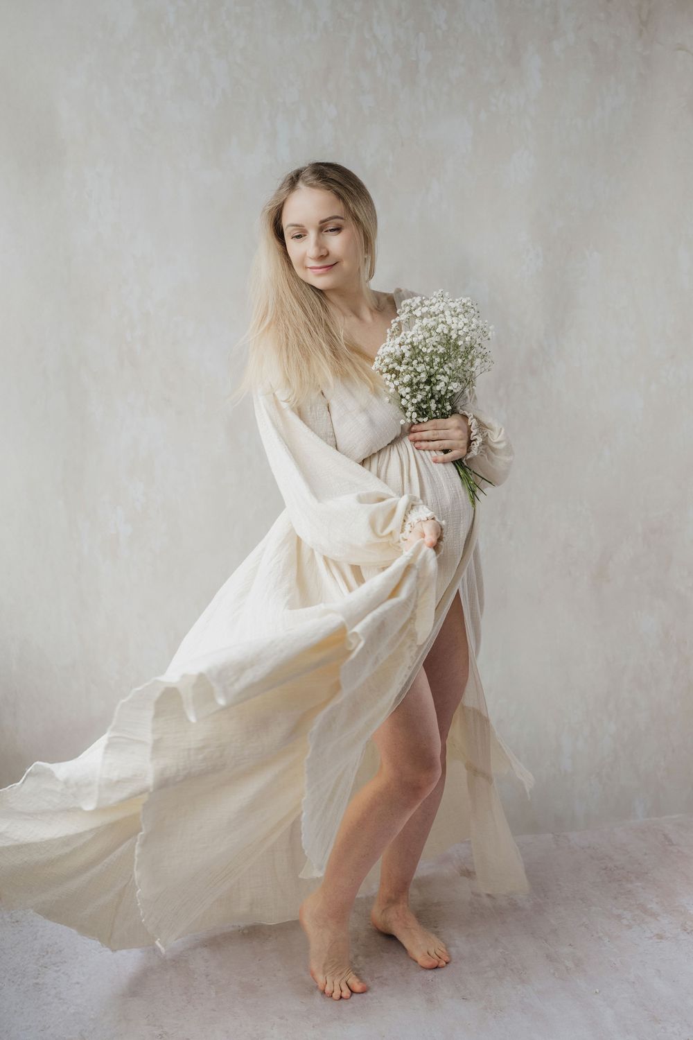 Ethereal white flowing dress and delicate baby's breath flowers create dreamy romantic portraits against a textured backdrop.