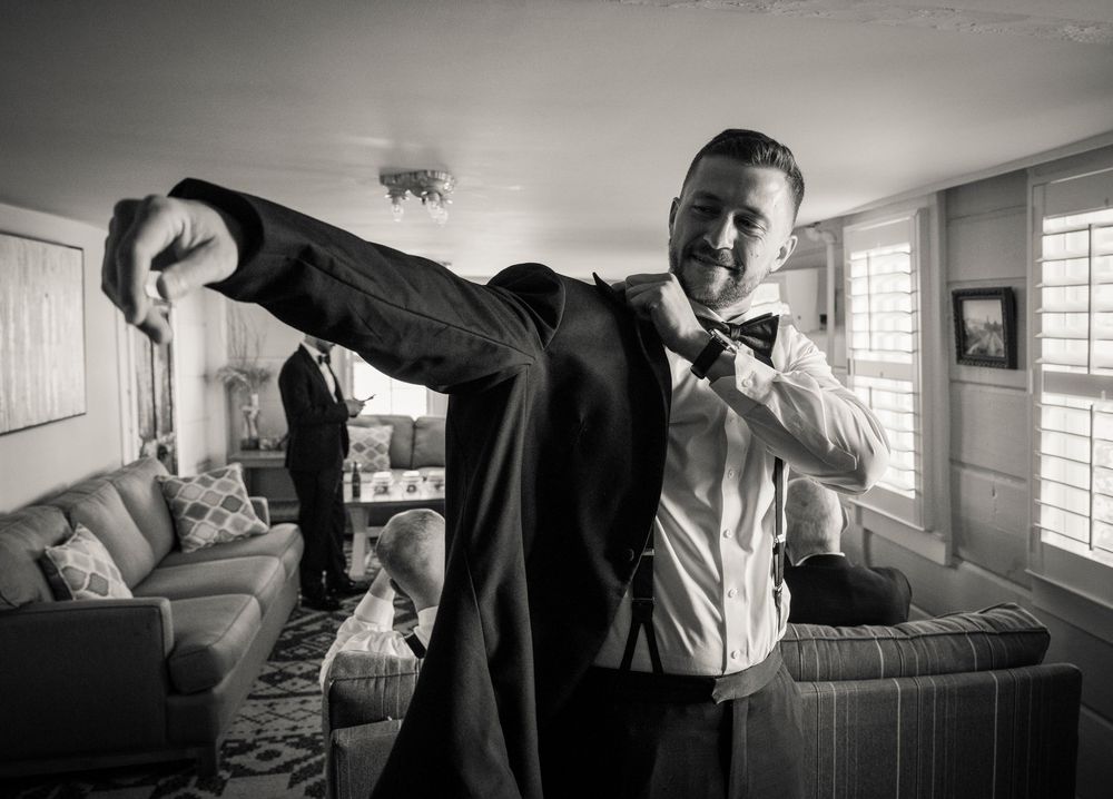 A series of black and white photographs showing intimate moments in a medical or nursing home setting.
