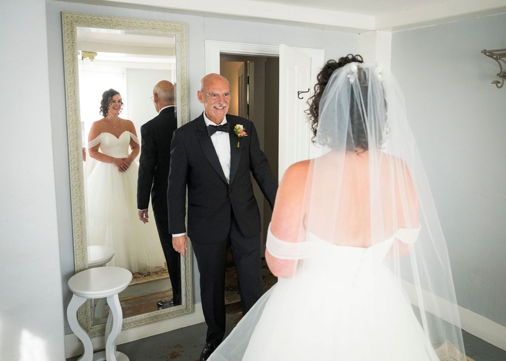 A series of wedding preparation photos showing a bride in a white dress and veil getting ready for the ceremony.