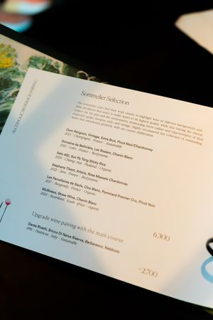 Detailed menu text printed on white paper showing dining selections and prices.