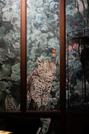 Large decorative wall panel featuring leopards against a misty blue-green forest background.