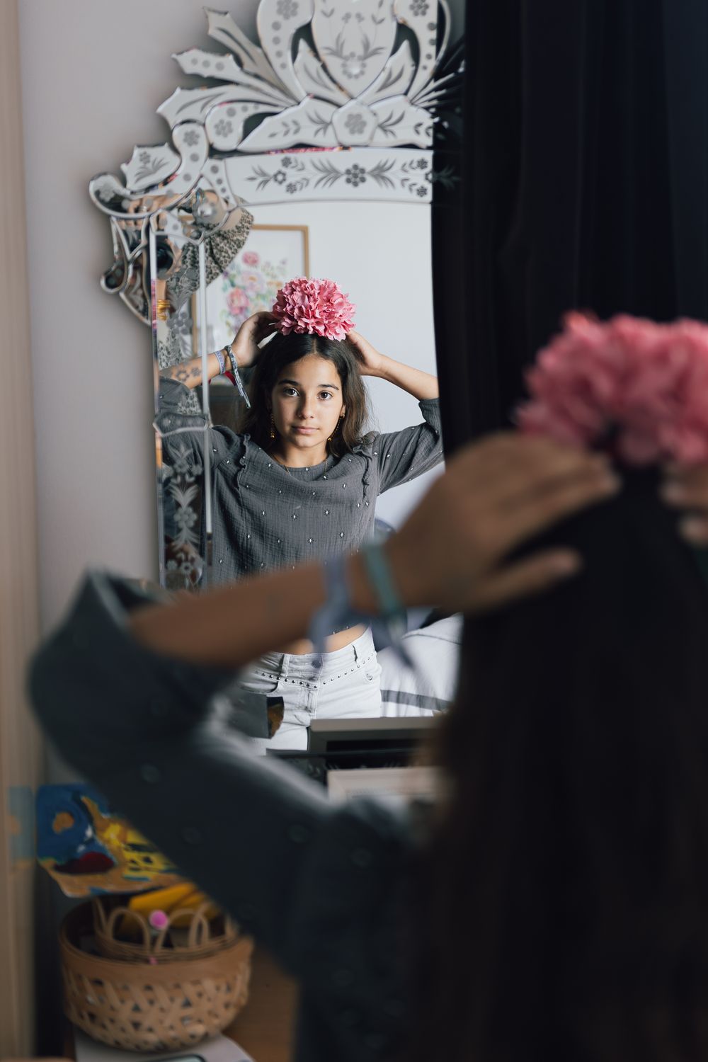 Artistic mirror reflection photography in a cozy home setting with decorative elements.