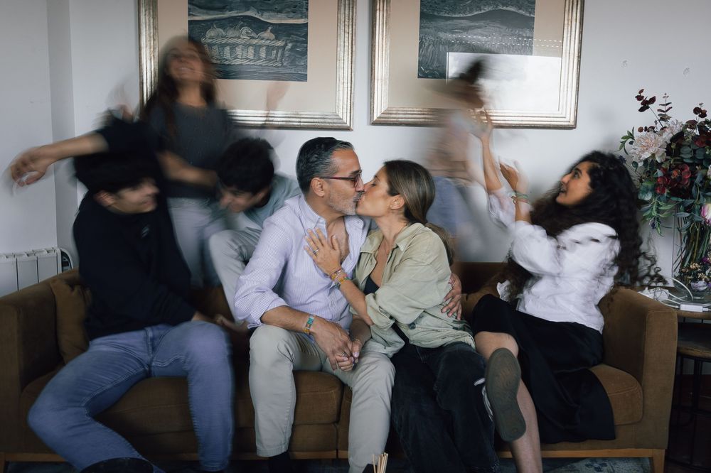 A series of motion-blurred photos showing people sitting and interacting on a couch in a living room setting.