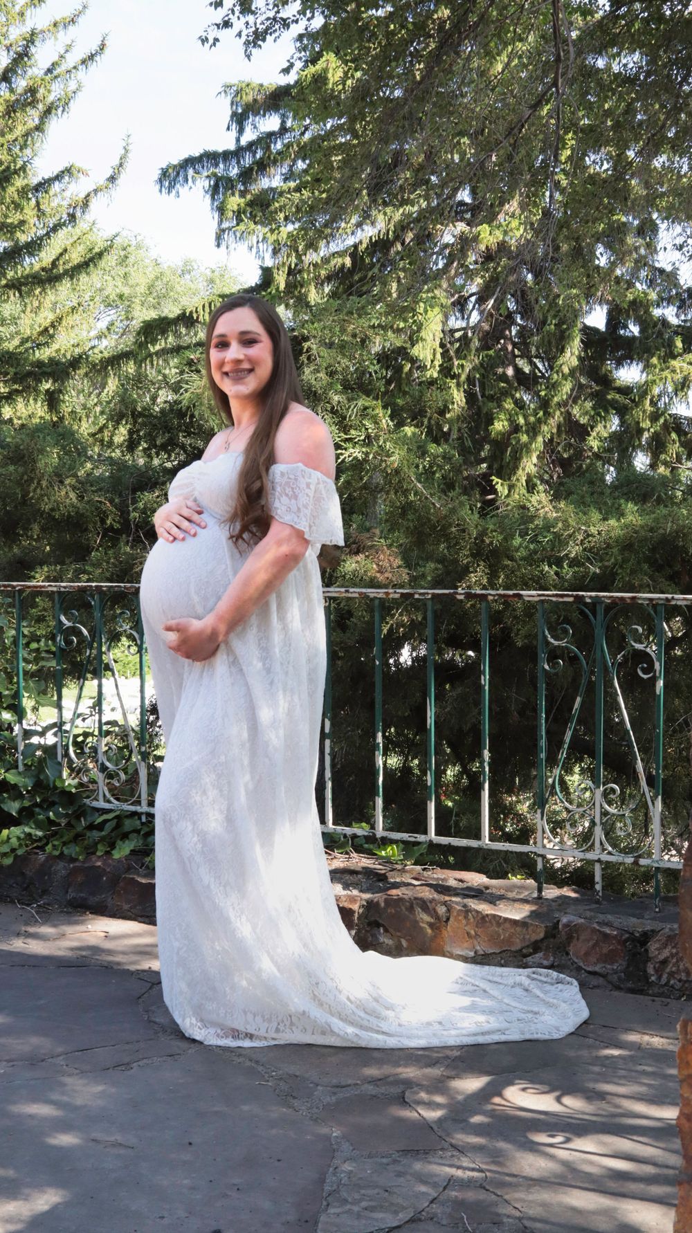 Pregnant woman standing outdoors during a natural maternity photography session in Utah