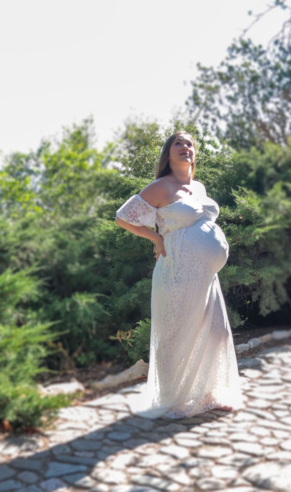 Pregnant woman standing outdoors during a natural maternity photography session in Utah