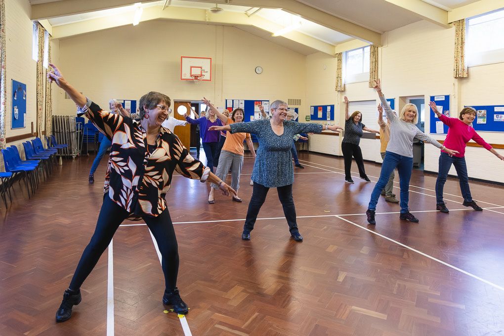 A group of seniors line dancing in Letchworth, Hertfordshire.