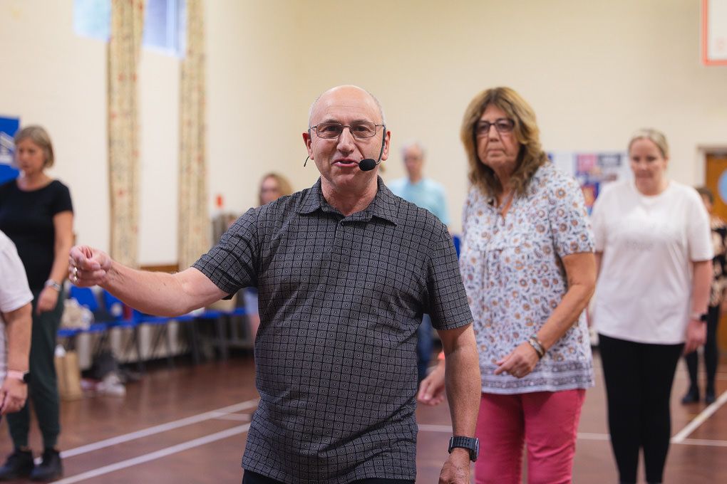 Footsteps Dance School in Letchworth. People dancing together in a community hall during a social dance class.
