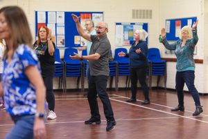 People participate in a dance class in the Letchworth Community Centre.