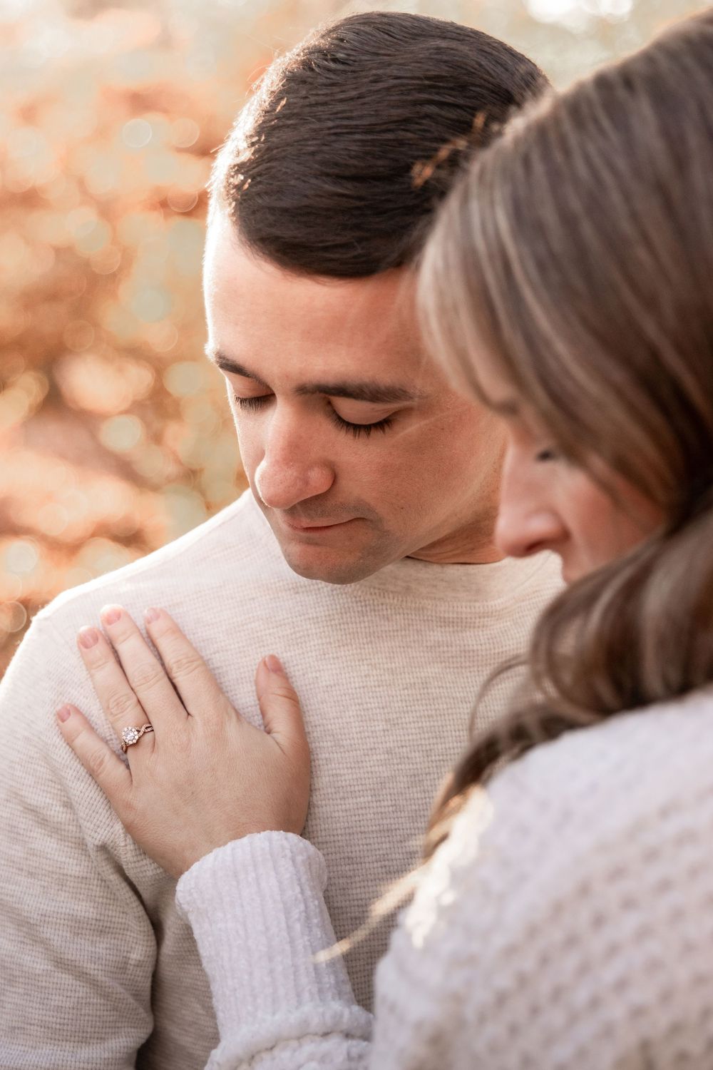 Intimate couple sharing tender moments in a series of romantic close-up photos with warm peachy tones.