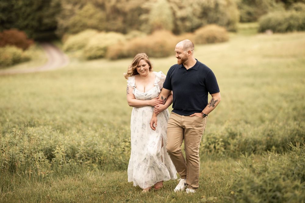 A couple in light-colored outfits shares romantic moments across a series of photos in a sunlit meadow.