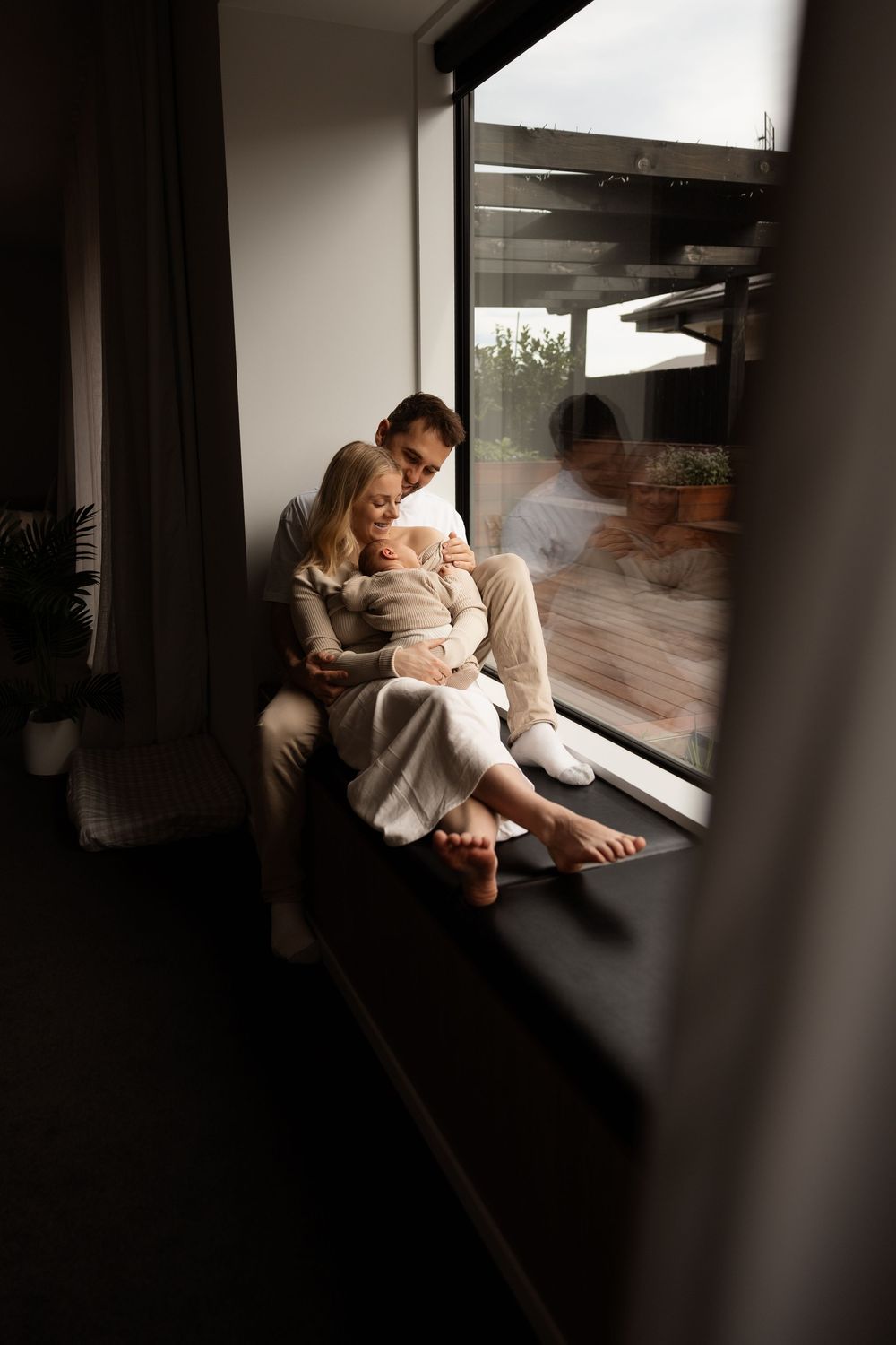in home newborn session, cuddling mum and dad sleeping