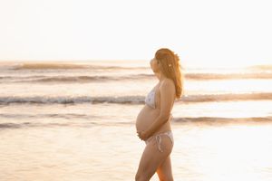 sunrise solo mum maternity session at waimari beach in christchurch