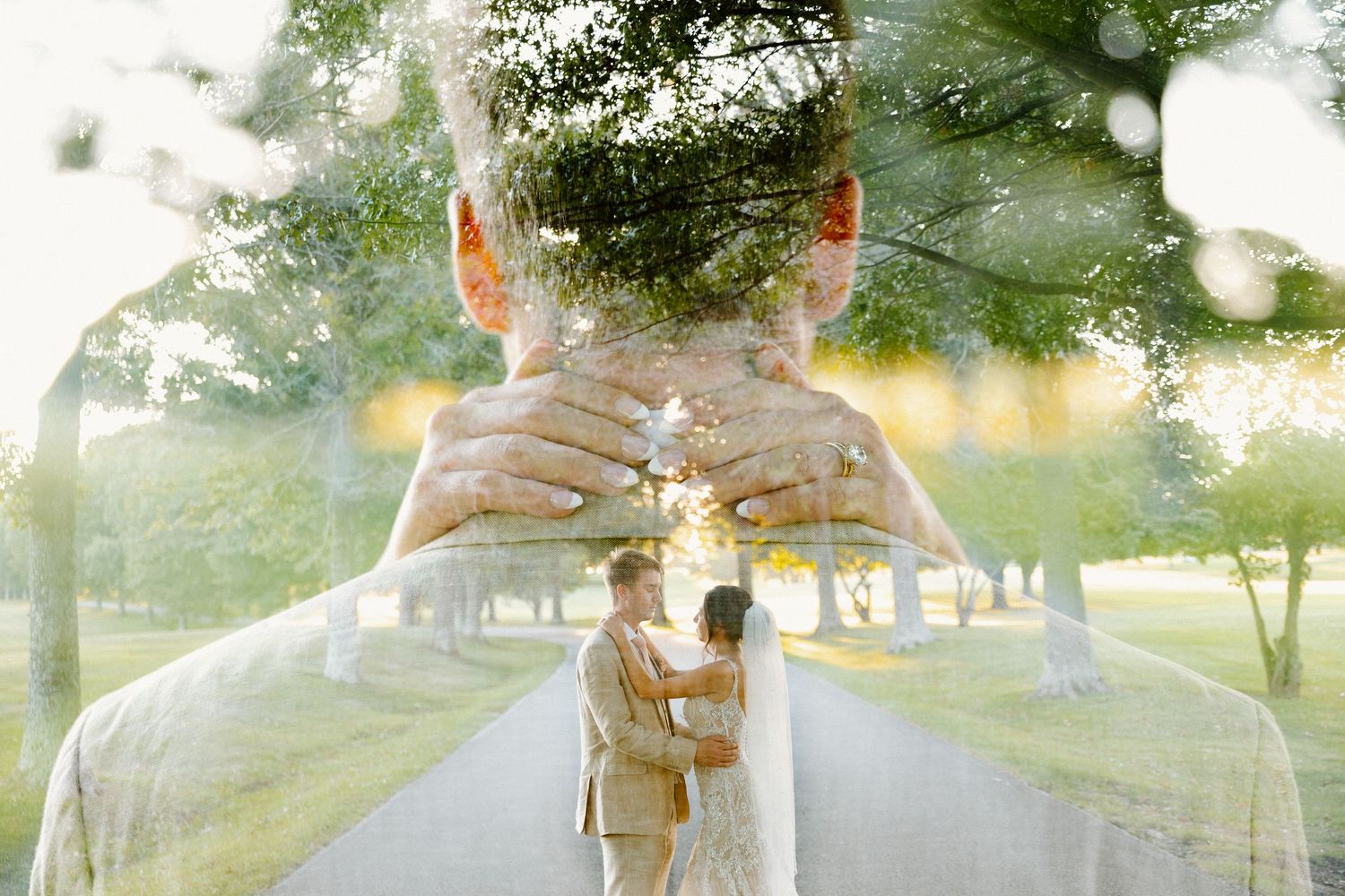 Double exposure wedding photo overlays couple with tree-lined path creating dreamy effect.