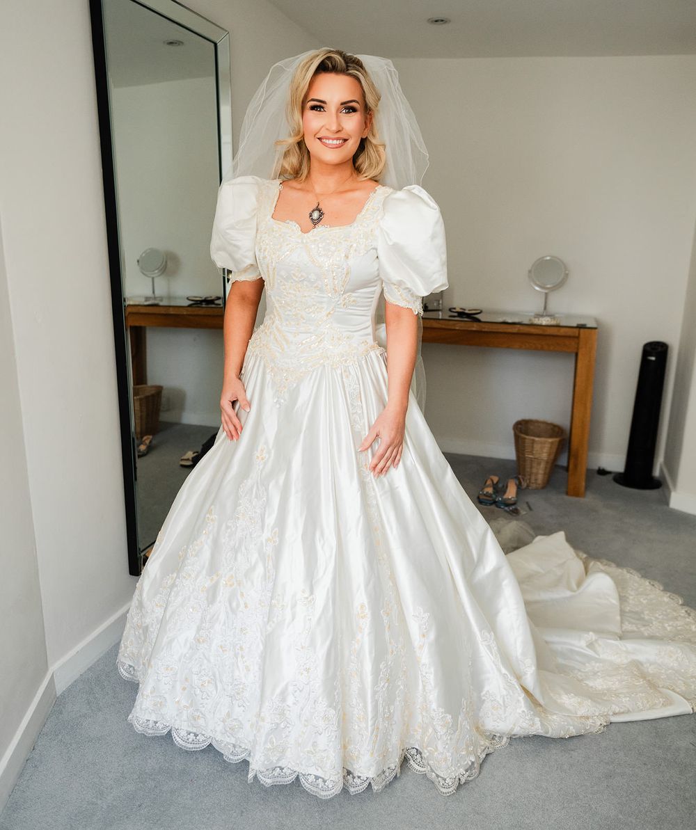 A series of photos showing a white lace wedding dress with empire waist and short puff sleeves in different angles.