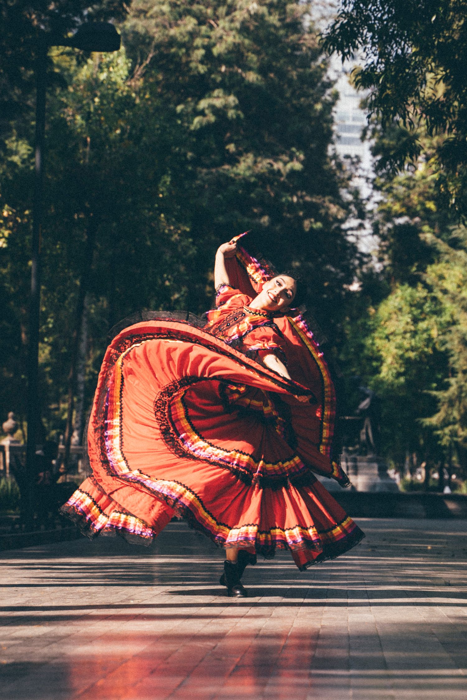 Ballet Folklórico dancer showcasing skirt work and cultural expression in Alameda Central Park