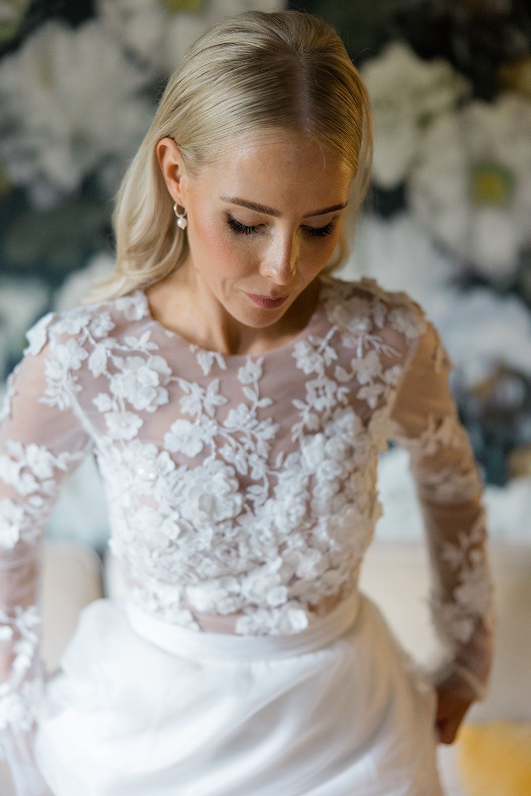 Black and white wedding photo series showing close-up details of bride's dress and shoes during preparation.