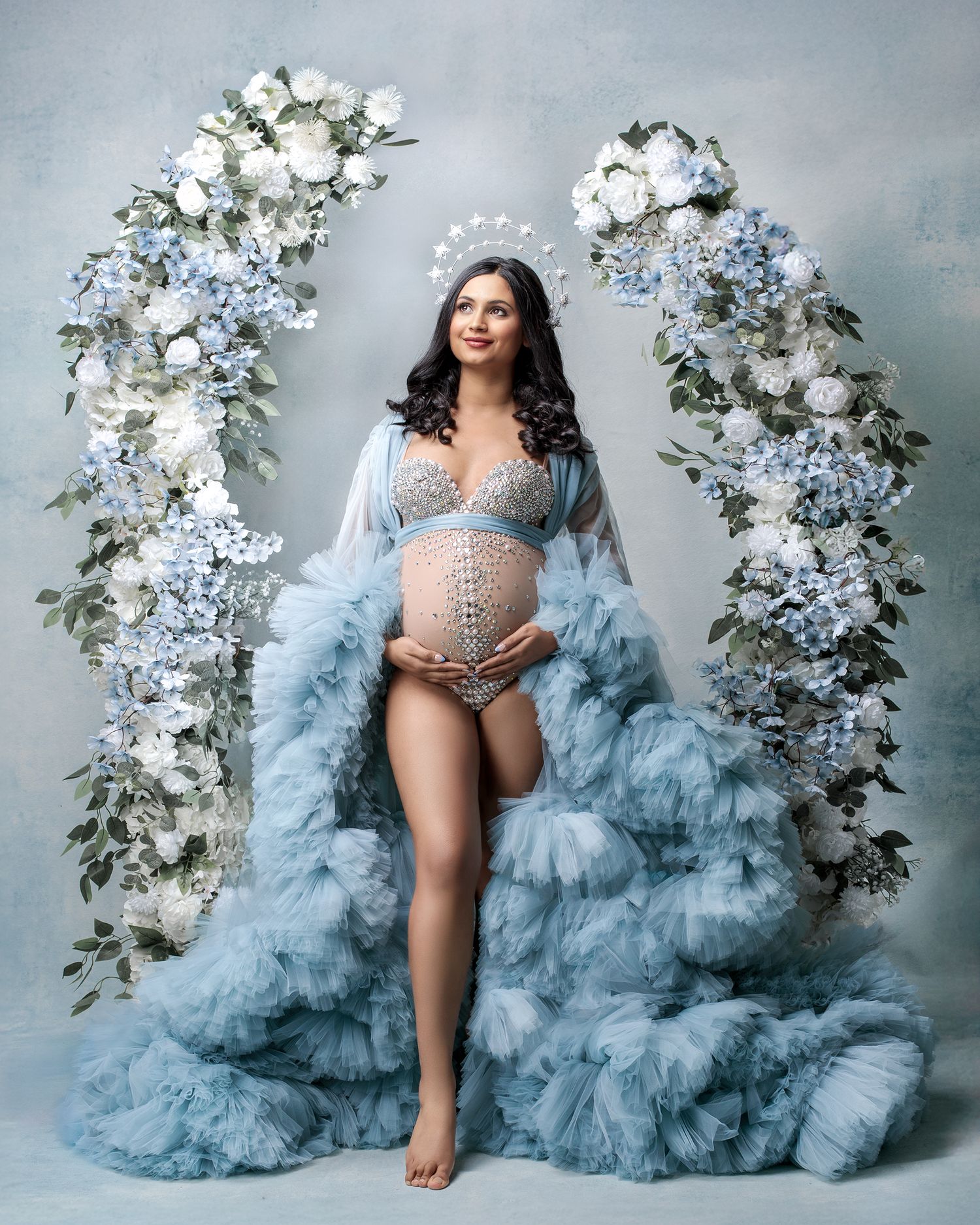 Timeless studio portrait of a woman glowing during her pregnancy, wearing an ethereal couture gown, shot by Sydney photographer Caz Captures