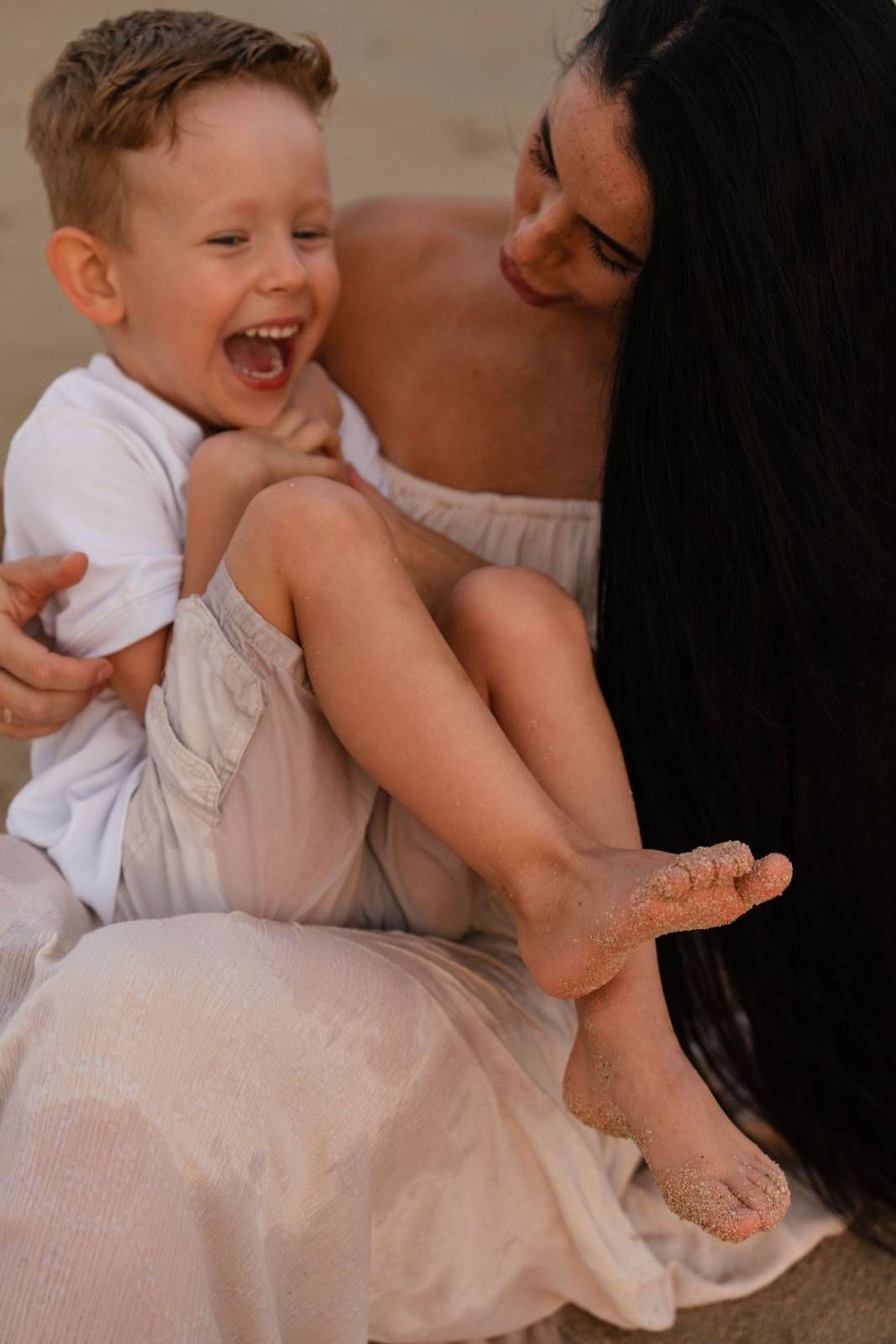 Father teaching and embracing young child together in intimate family moment