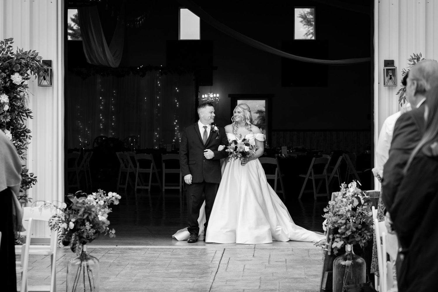 A series of black and white wedding photographs arranged in a horizontal filmstrip style collage.